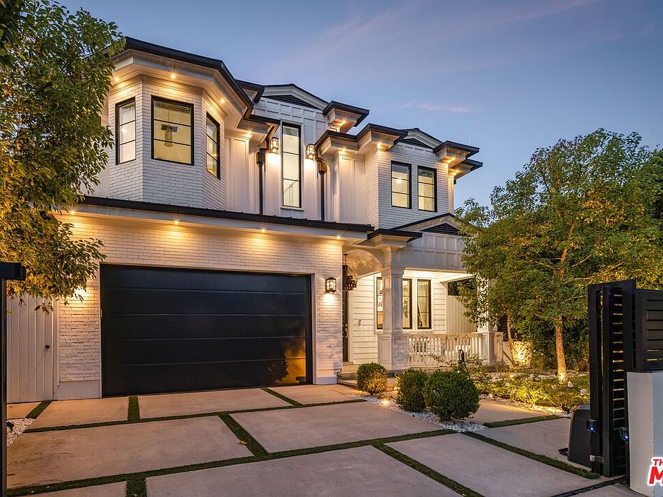 A modern Cape Cod facade in Beverly Grove with white brick and bold black accents at 8147 W 4th Street.